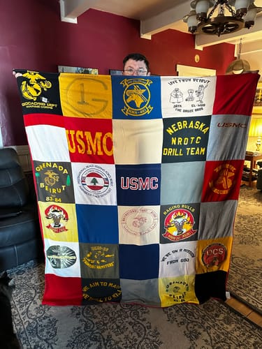 T-shirt quilt with military service, veteran support themes by F. Carolyn from NE