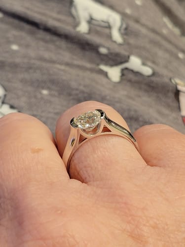 Customer photo review of Solitaire Moissanite Half Bezel Set Sterling Silver Engagement Ring