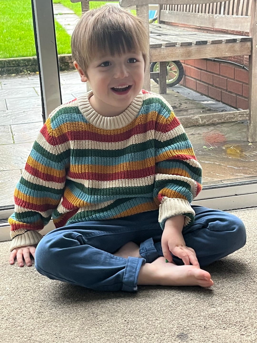 Customer photo review of From One To Another Rainbow Striped Snuggly Knitted Jumper