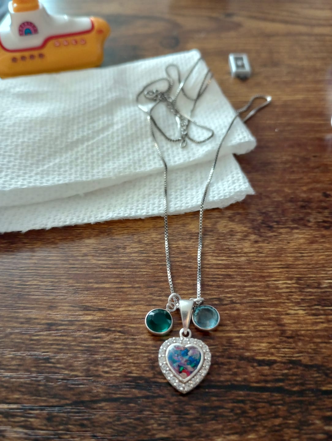 Customer photo review of Petite Bedazzled Opal Heart Pendant