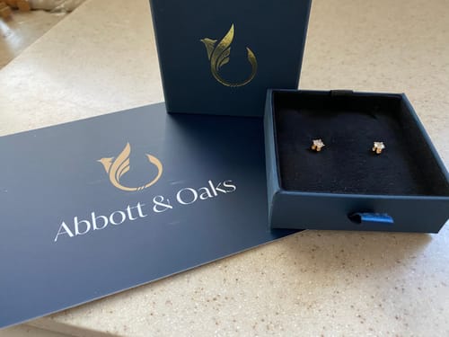 Customer photo review of VINTAGE 14K YELLOW GOLD .19CTTW DIAMOND BUTTERCUP STUD EARRINGS
