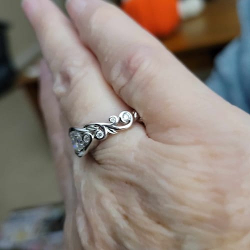 Customer photo review of Bezel Set Round Moissanite Scroll Accents Engagement Ring