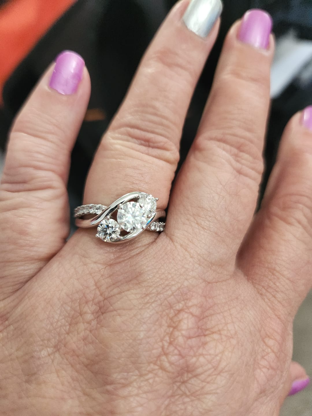 Customer photo review of Swirl Three Stone Moissanite Twisted Pave Engagement Ring