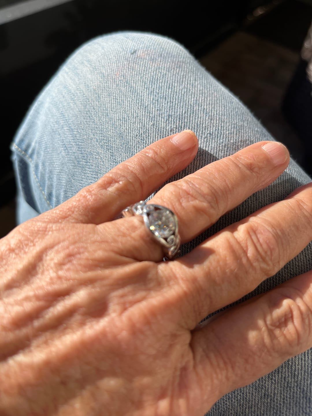 Customer photo review of Bezel Set Round Moissanite Scroll Accents Engagement Ring