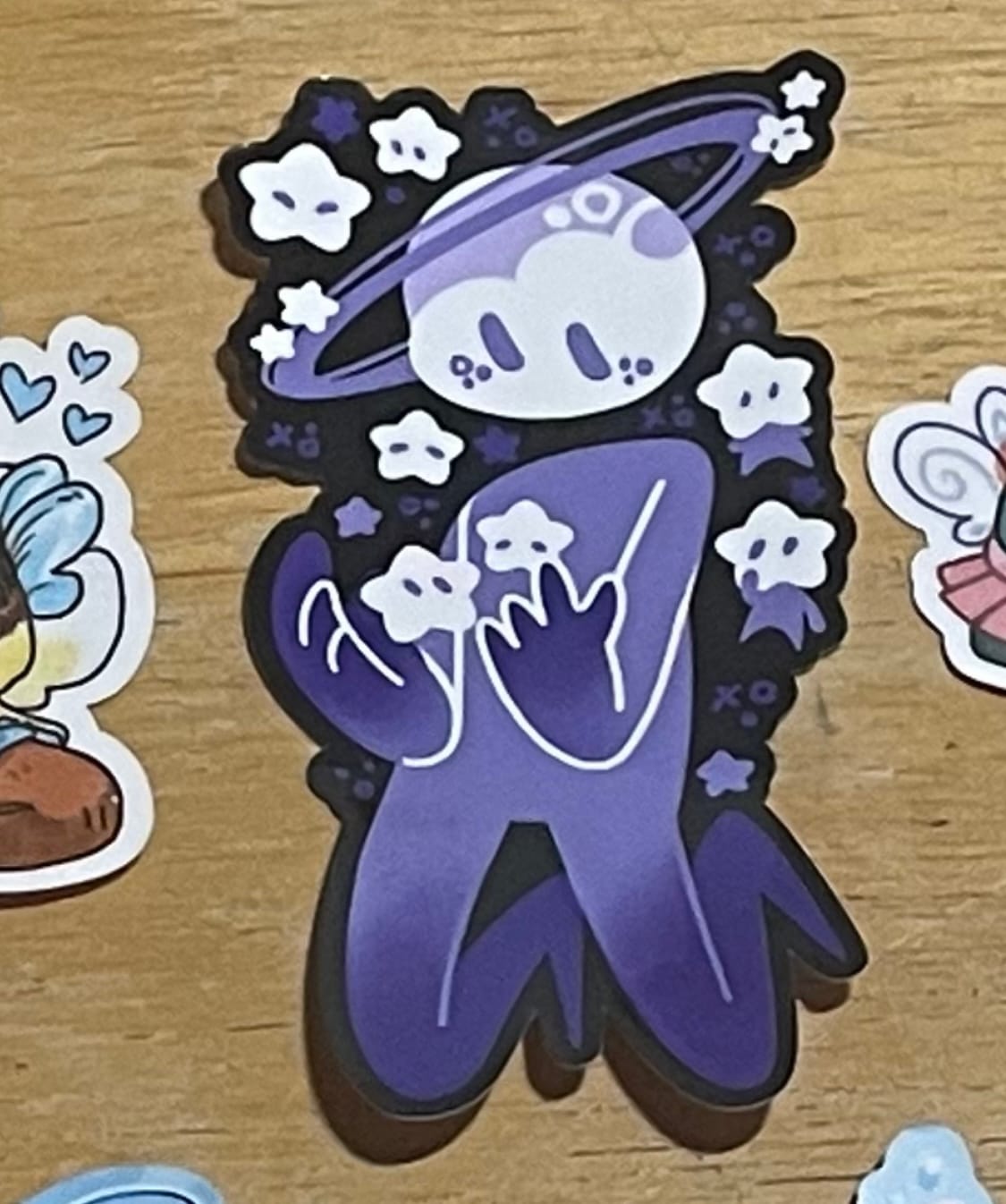 Customer photo review of Planet Person With Star Babies Sticker