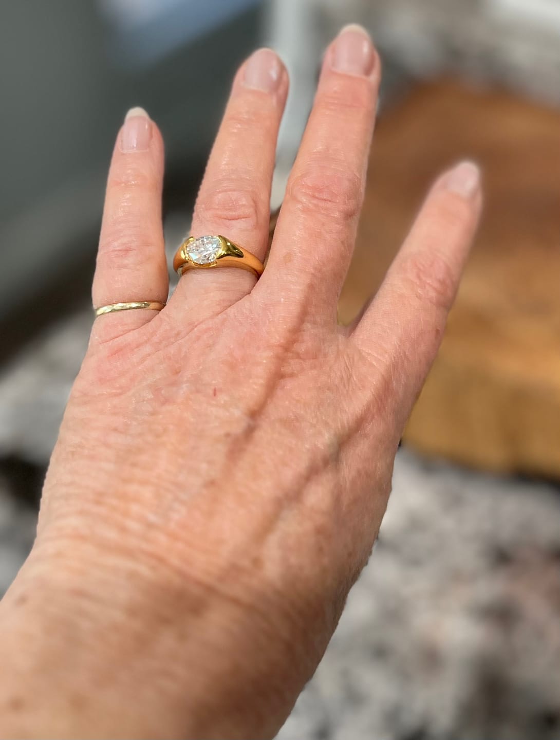 Customer photo review of Solitaire Oval Moissanite Half Bezel Set Engagement Ring