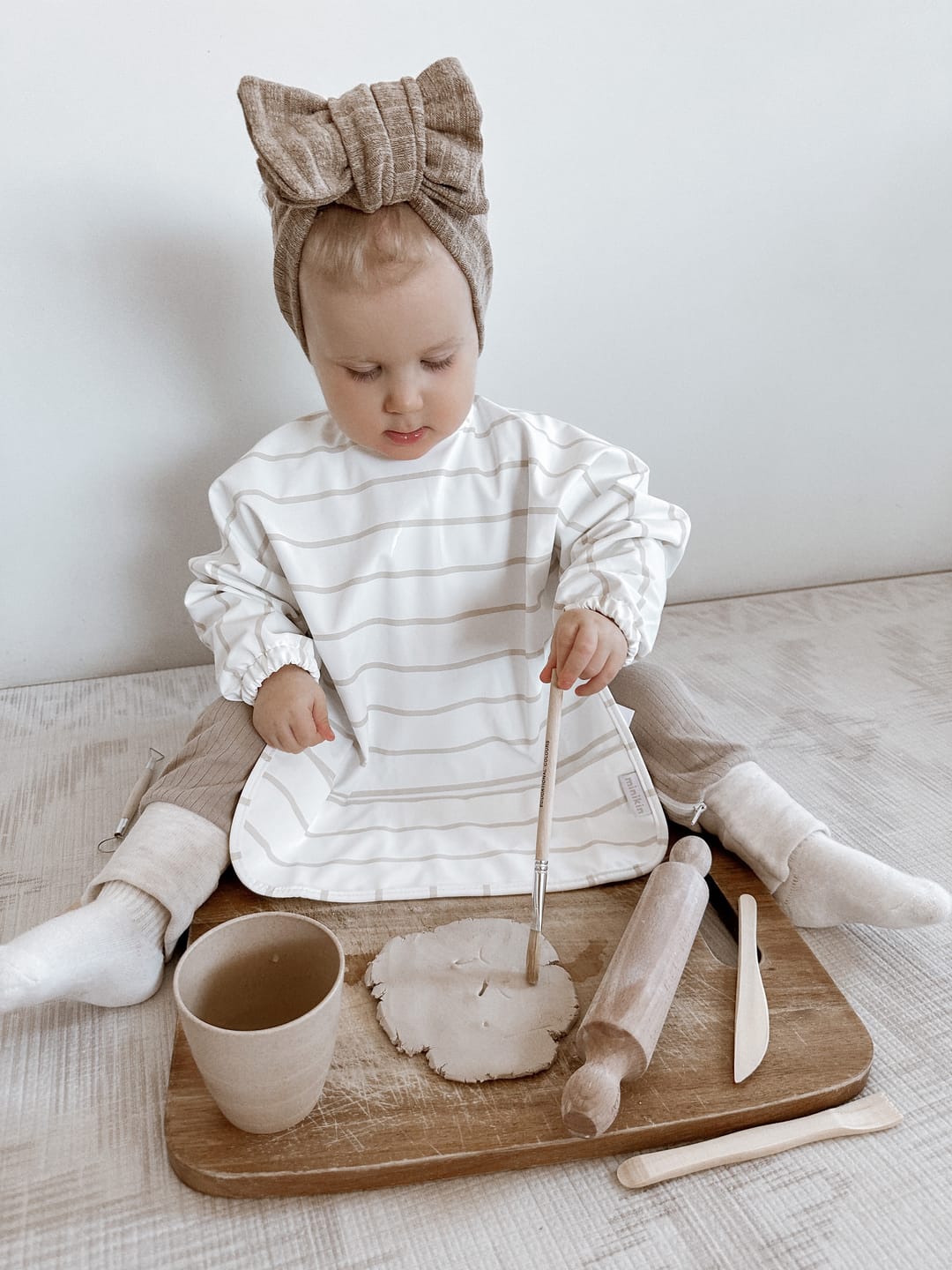 Customer photo review of Mess-Free Smock Bib | Beige Stripe