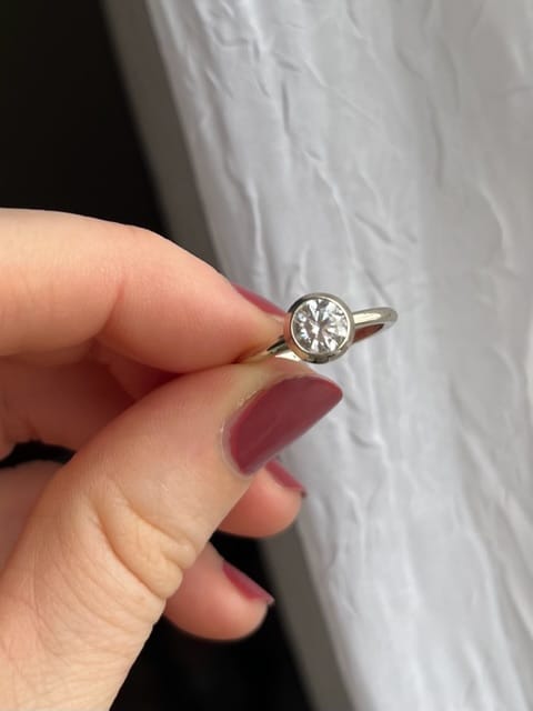 Customer photo review of 5x5 Colorless Moissanite Yellow Gold Bezel Ring - Forever One Moissanite