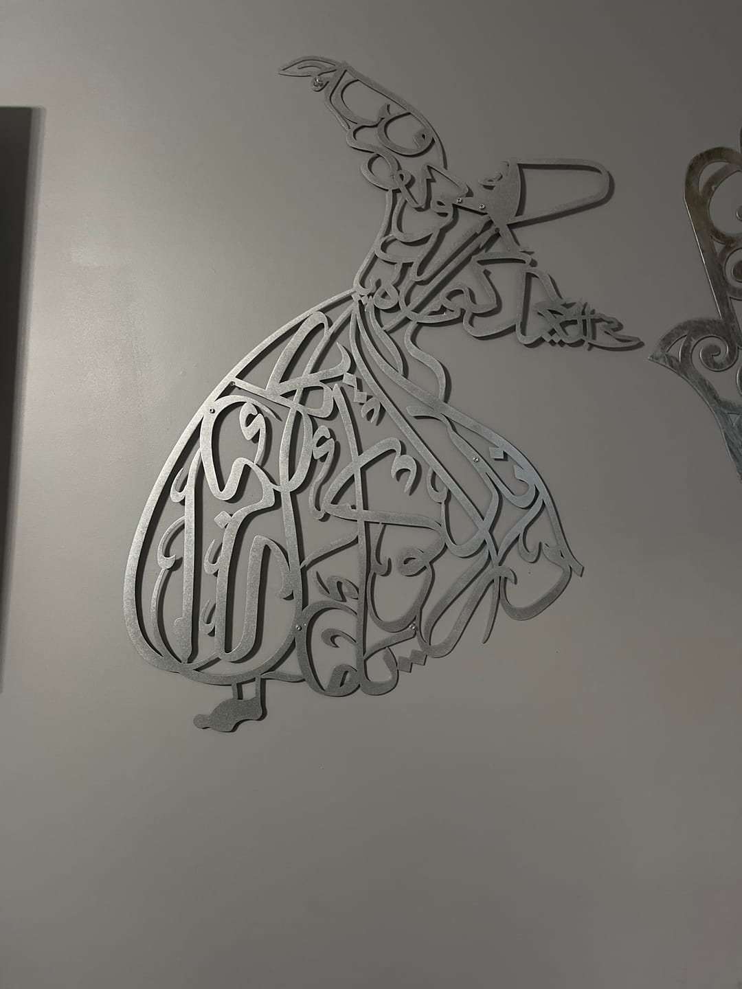 Customer photo review of Whirling Dervish Metal Islamic Wall Art
