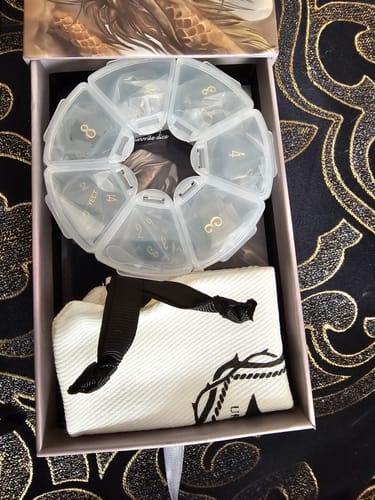 Customer photo review of URWizards D&D Labradorite Gemstone Engraved Dice Set YEET & F*CK