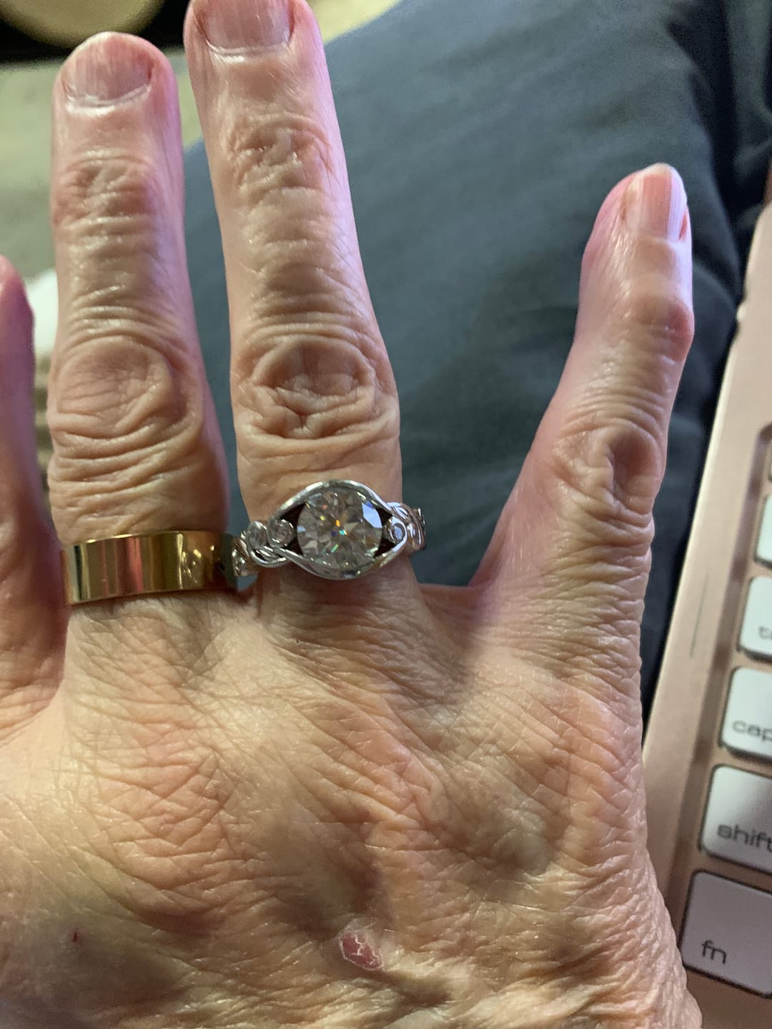 Customer photo review of Bezel Set Round Moissanite Scroll Accents Engagement Ring