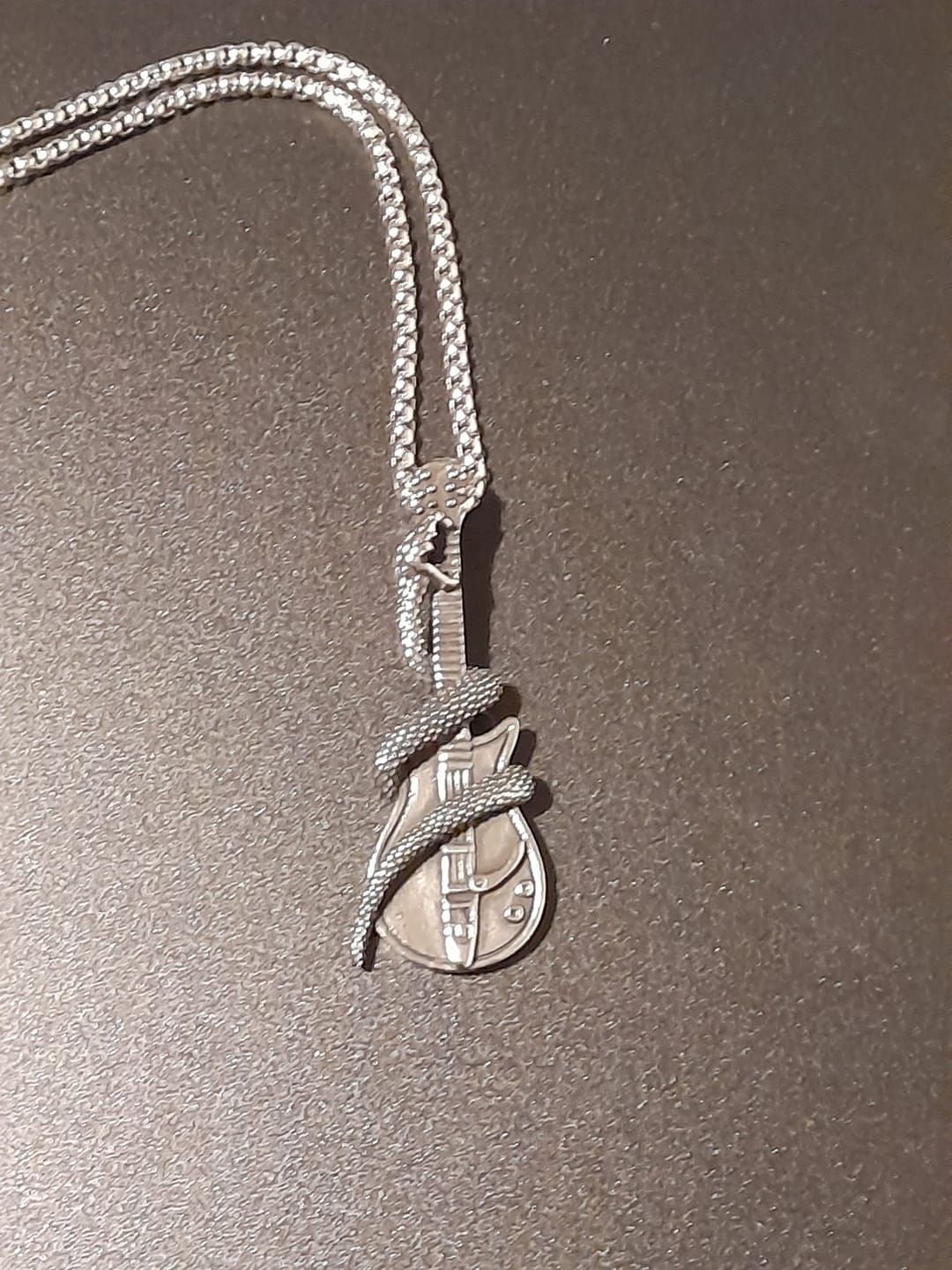 Customer photo review of THE SERPENT GUITAR. - NECKLACE