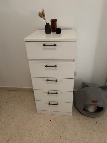 Customer photo review of Clásico tirador de zamak en acabado cuero envejecido de 96mm entre ejes para muebles