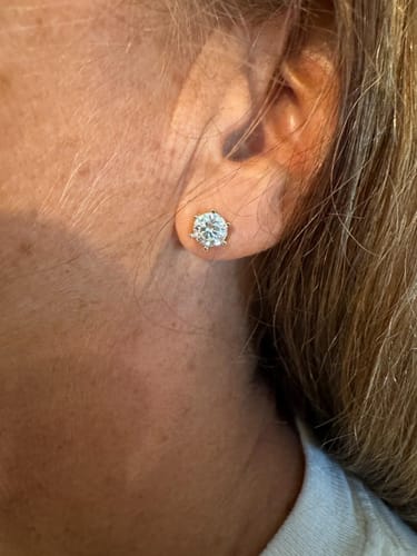 Customer photo review of Luxuria Moissanite 14K White Gold Plated Silver Stud Earrings
