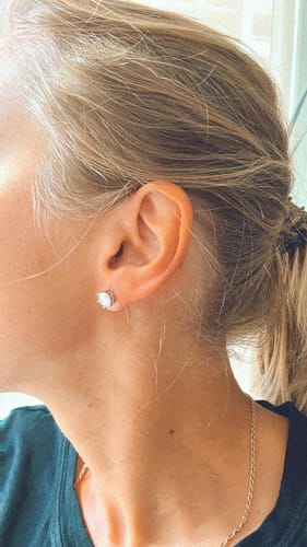 Customer photo review of Luxuria Moissanite 14K White Gold Plated Silver Stud Earrings