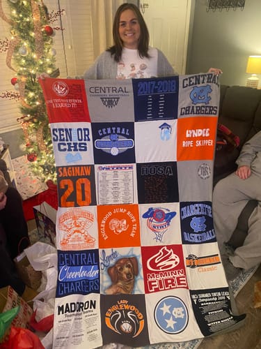 T-shirt quilt featuring central chargers by Dee from TN