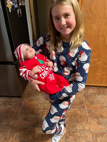 Customer photo review of Christmas Reborn Baby Doll 20” 2 to 8 Pounds Weighted Newborn Lifelike Reborns Soft Heavy Baby Dolls Children Child Friendly Gifts For Girls
