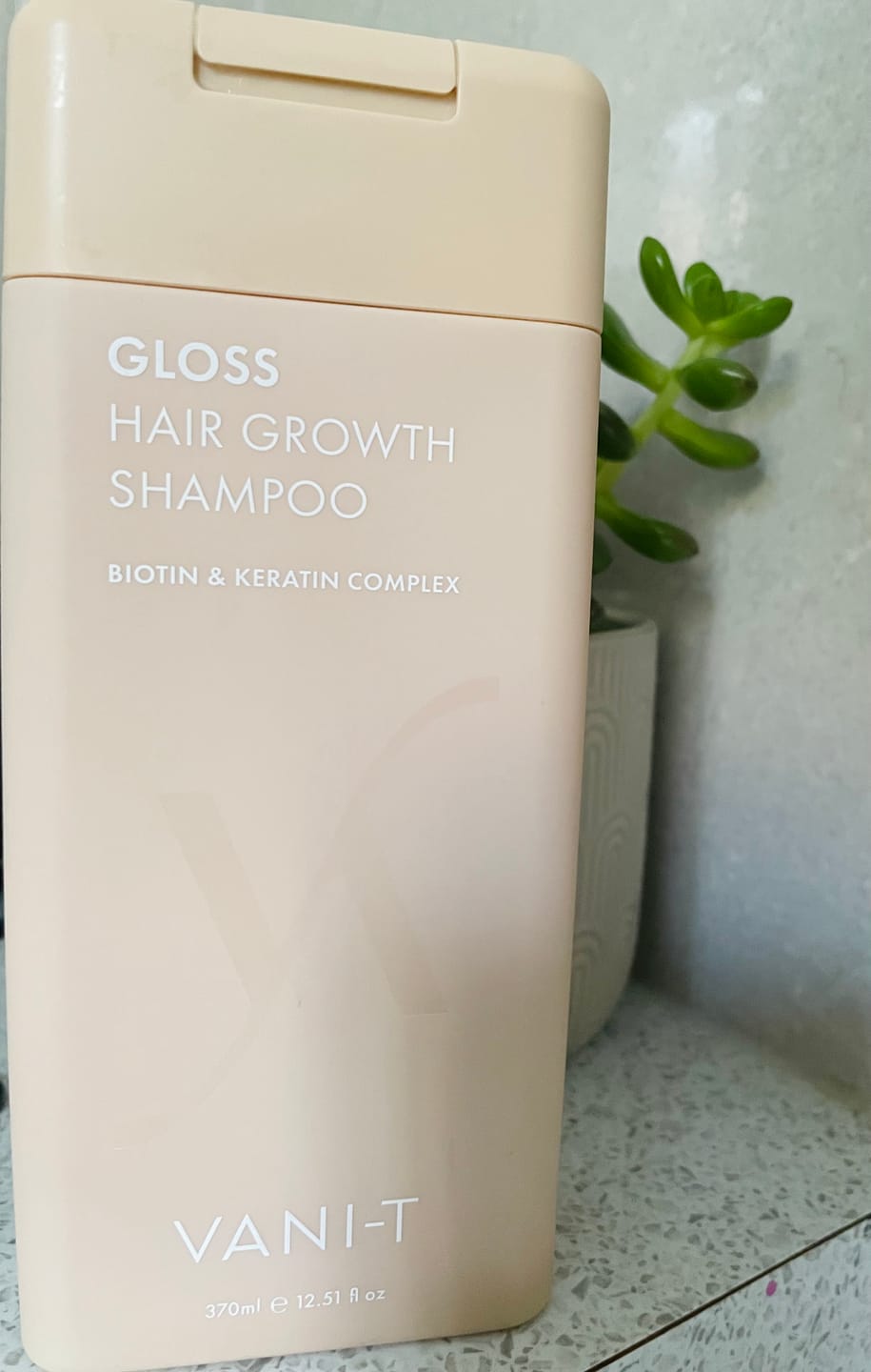Customer photo review of Gloss Hair Growth Shampoo