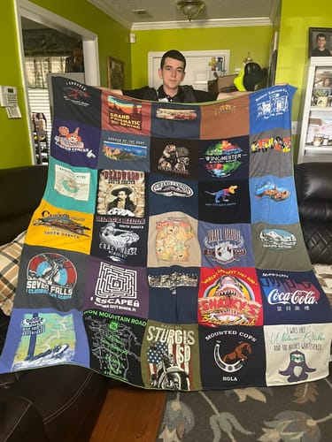 T-shirt quilt with travel, adventure themes by Deborah from AL