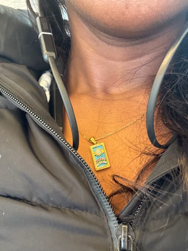 Customer photo review of The Sun - Tarot card Dainty 18k Necklace with Blue Enamel