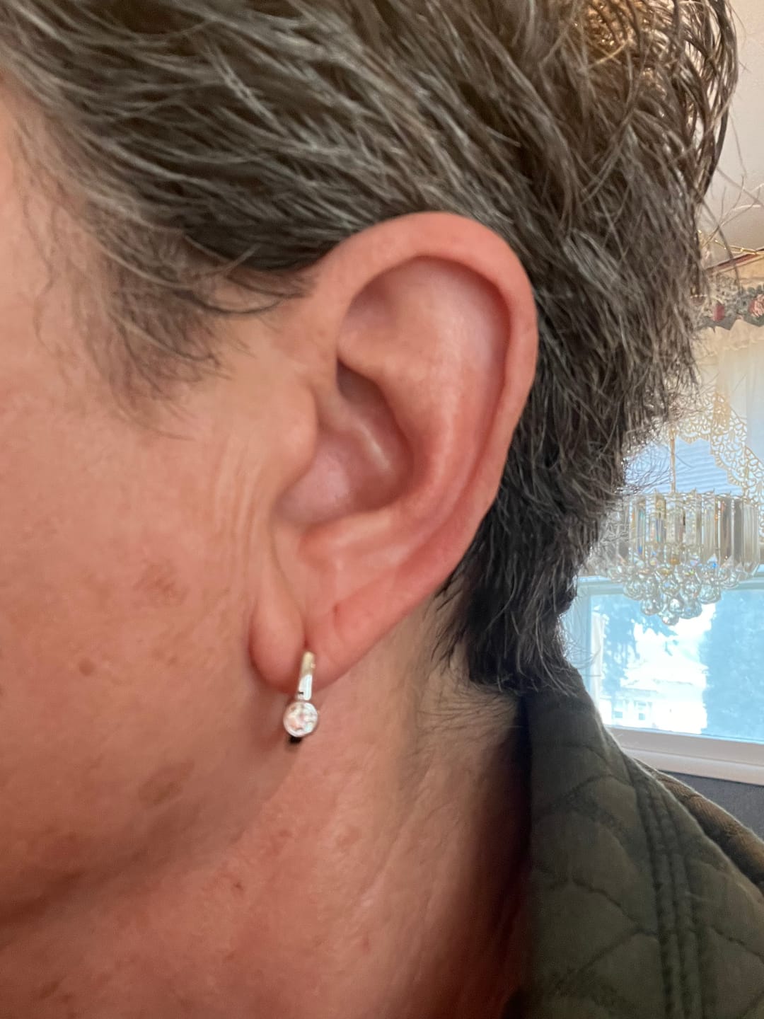 Customer photo review of Solitaire Huggie Bezel Moissanite Hoop Earrings In Sterling Silver