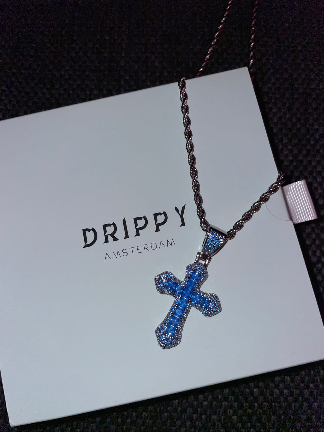 Customer photo review of BLUE CROSS PENDANT. - WHITE GOLD