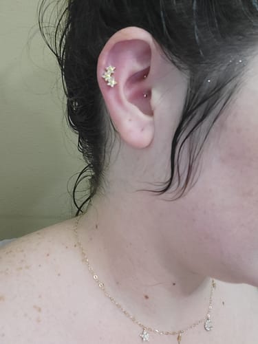 Customer photo review of Triple Star Gem Top Internally Threaded Cartilage Ring