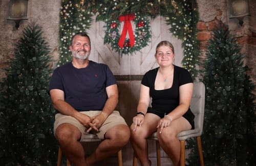Customer photo review of Kate Christmas Backdrop Brick Wall Door & Xmas Trees Designed By JS Photography