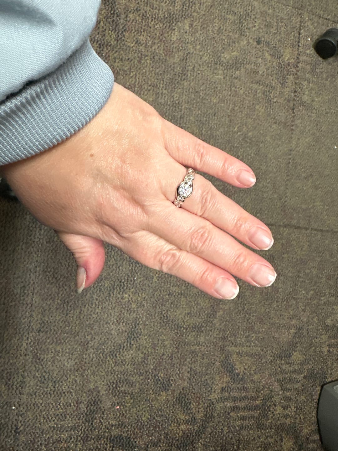 Customer photo review of Bezel Set Round Moissanite Scroll Accents Engagement Ring