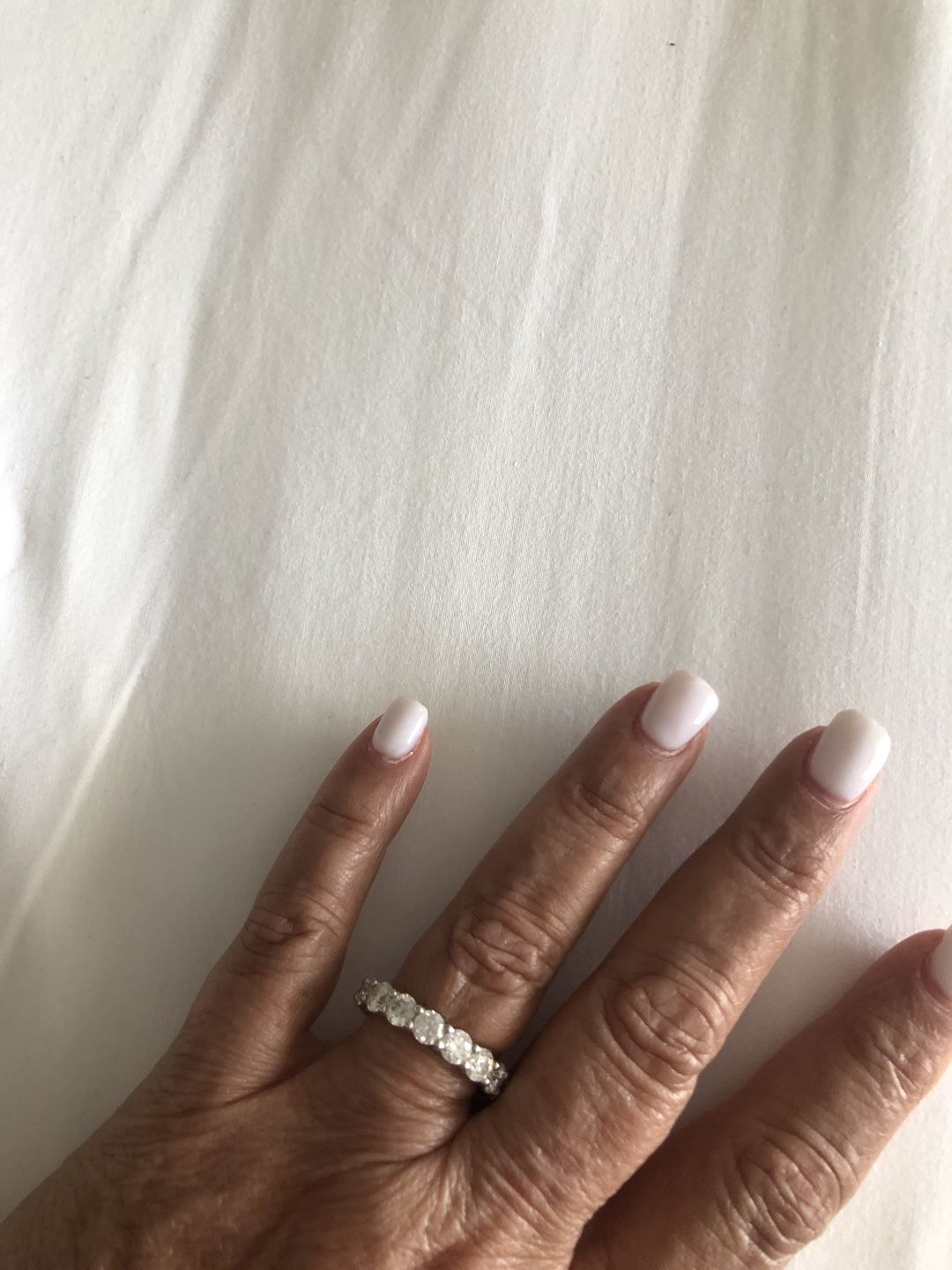 Customer photo review of Round Moissanite Eternity Sterling Silver Wedding Band Ring