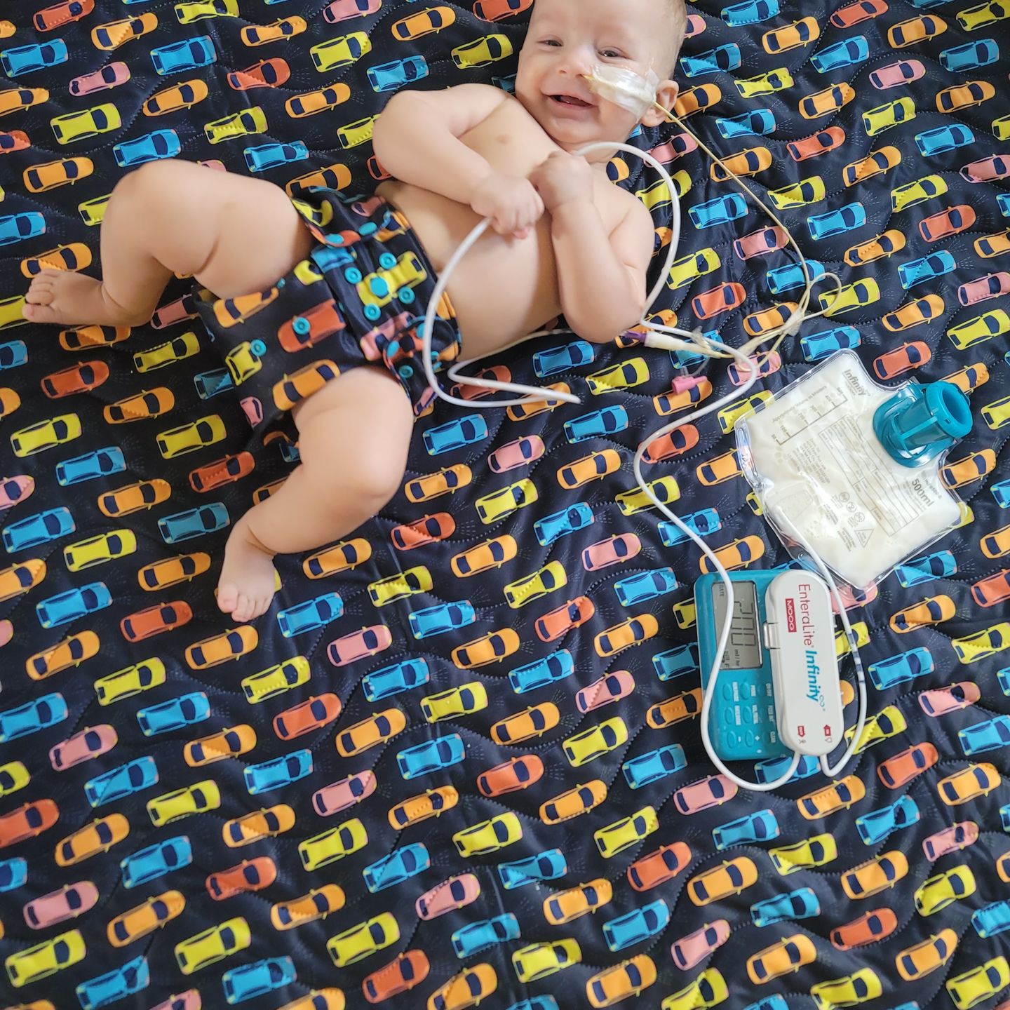 Customer photo review of Patterned Machine Washable Reversible Indoor/Outdoor Quilted Water Resistant Play Mat Blanket