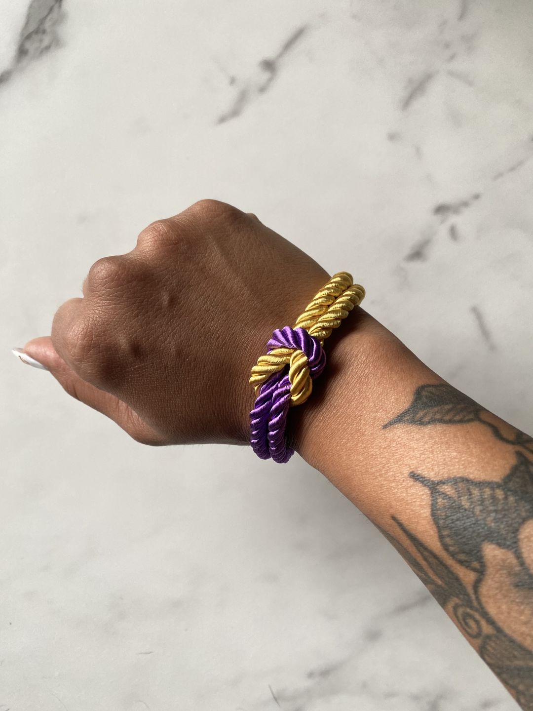Customer photo review of The Original Love Knot Satin Rope Bracelet- Purple and Gold