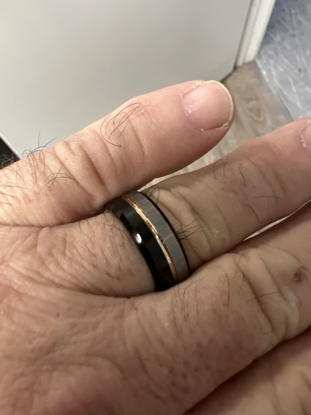 Customer photo review of 8MM - Black & Rose Gold Tungsten Ring Matte Finish Brushed Laser Horizontal Grain