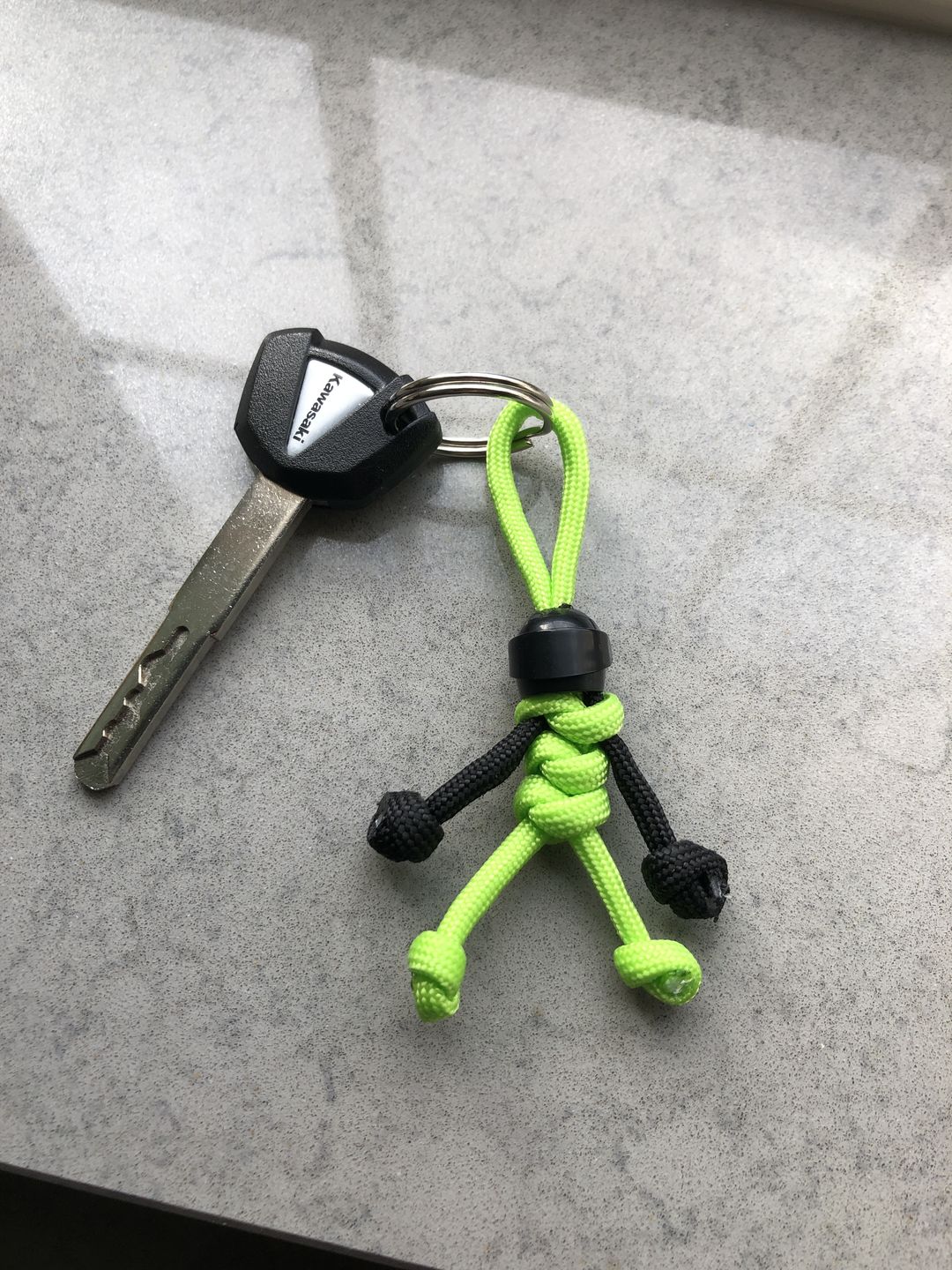 Customer photo review of Black Green Biker Buddy Paracord Keychain