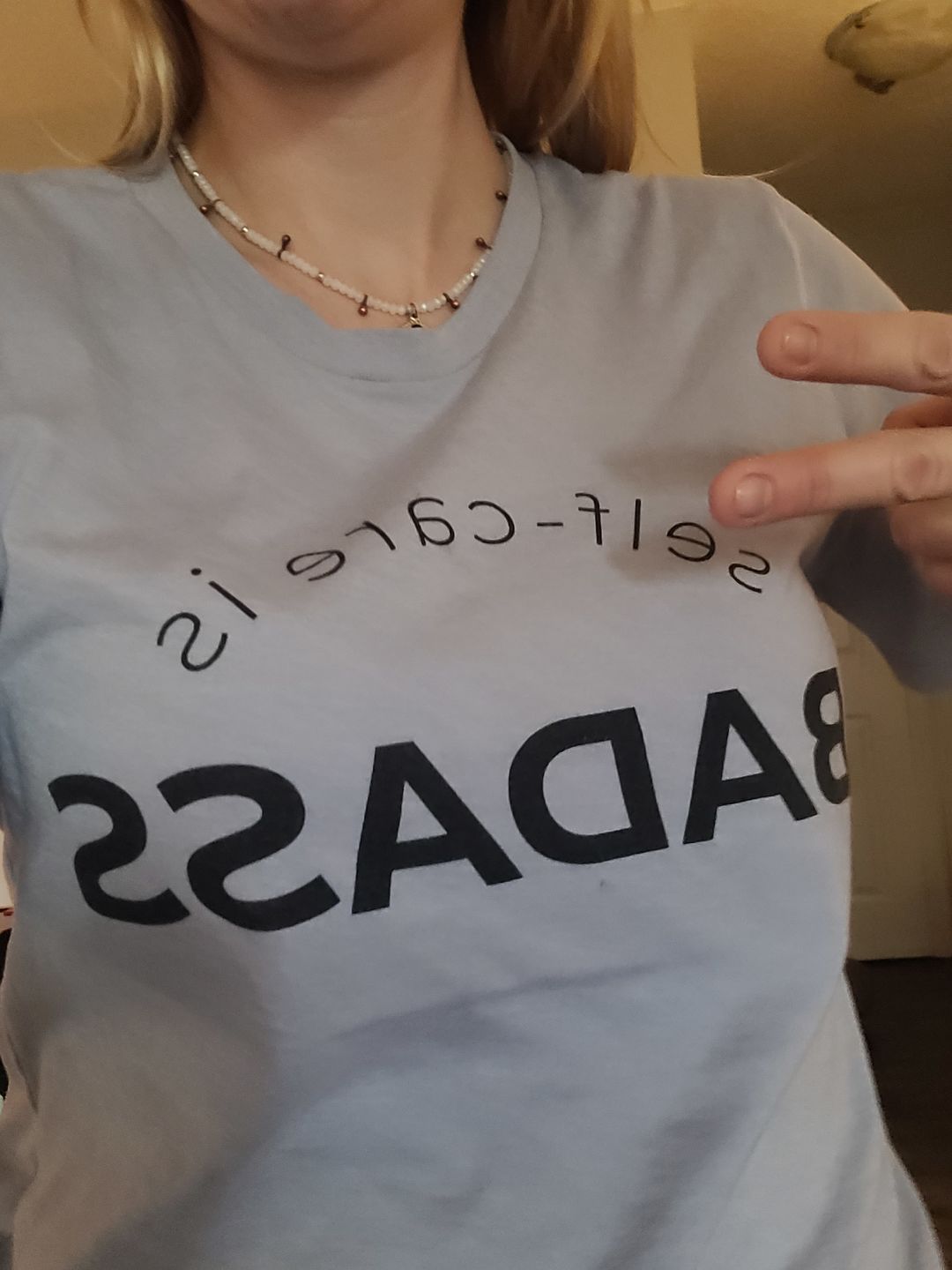 Customer photo review of Self-Care Is Badass T-Shirt