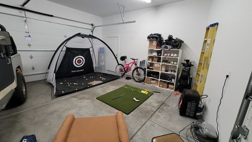 Customer photo review of Golf Practice Driving Net for Indoors and Outdoors | Tri-Turf Hitting Mat