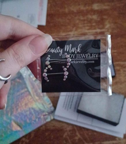 Customer photo review of PAIR Gem Curved Titanium Nipple Rings