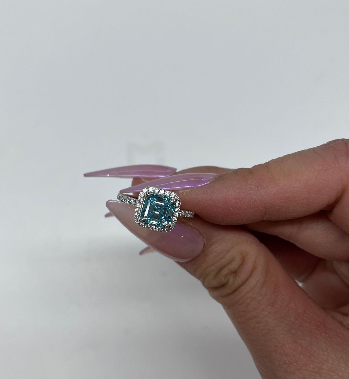 Customer photo review of Louily 2 Ct Exclusive Halo Asscher Cut Light Aquamarine Blue Engagement Ring