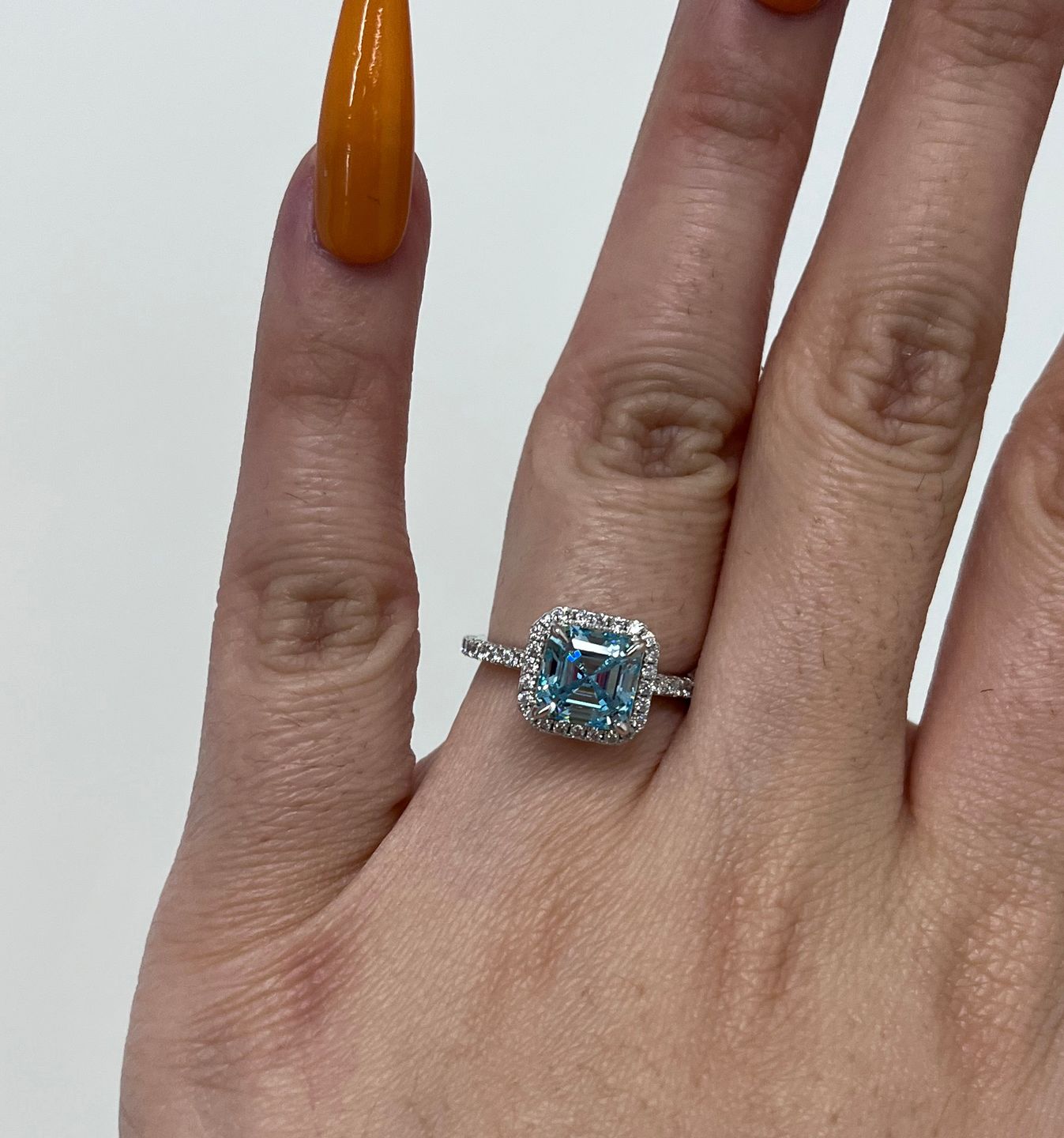 Customer photo review of Louily 2 Ct Exclusive Halo Asscher Cut Light Aquamarine Blue Engagement Ring