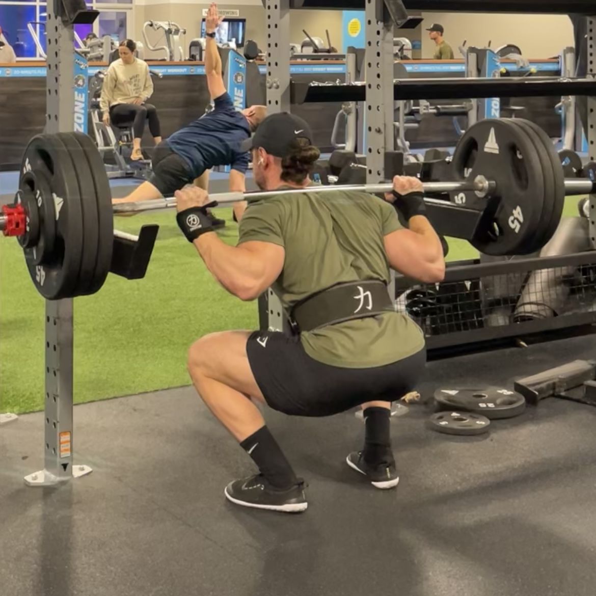 Customer photo review of Strength Shop Stiff Wrist Wraps - Black - USPA & IPF Approved