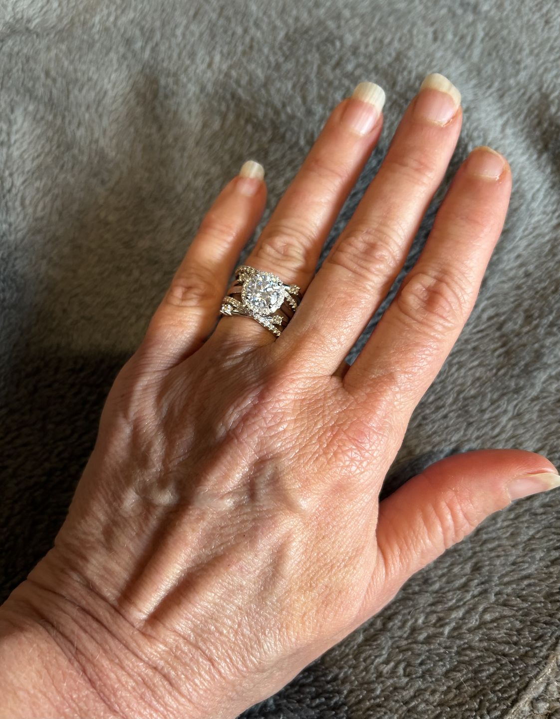 Customer photo review of Halo Moissanite With Enhancer Cross Shank Bridal Engagement Ring Set