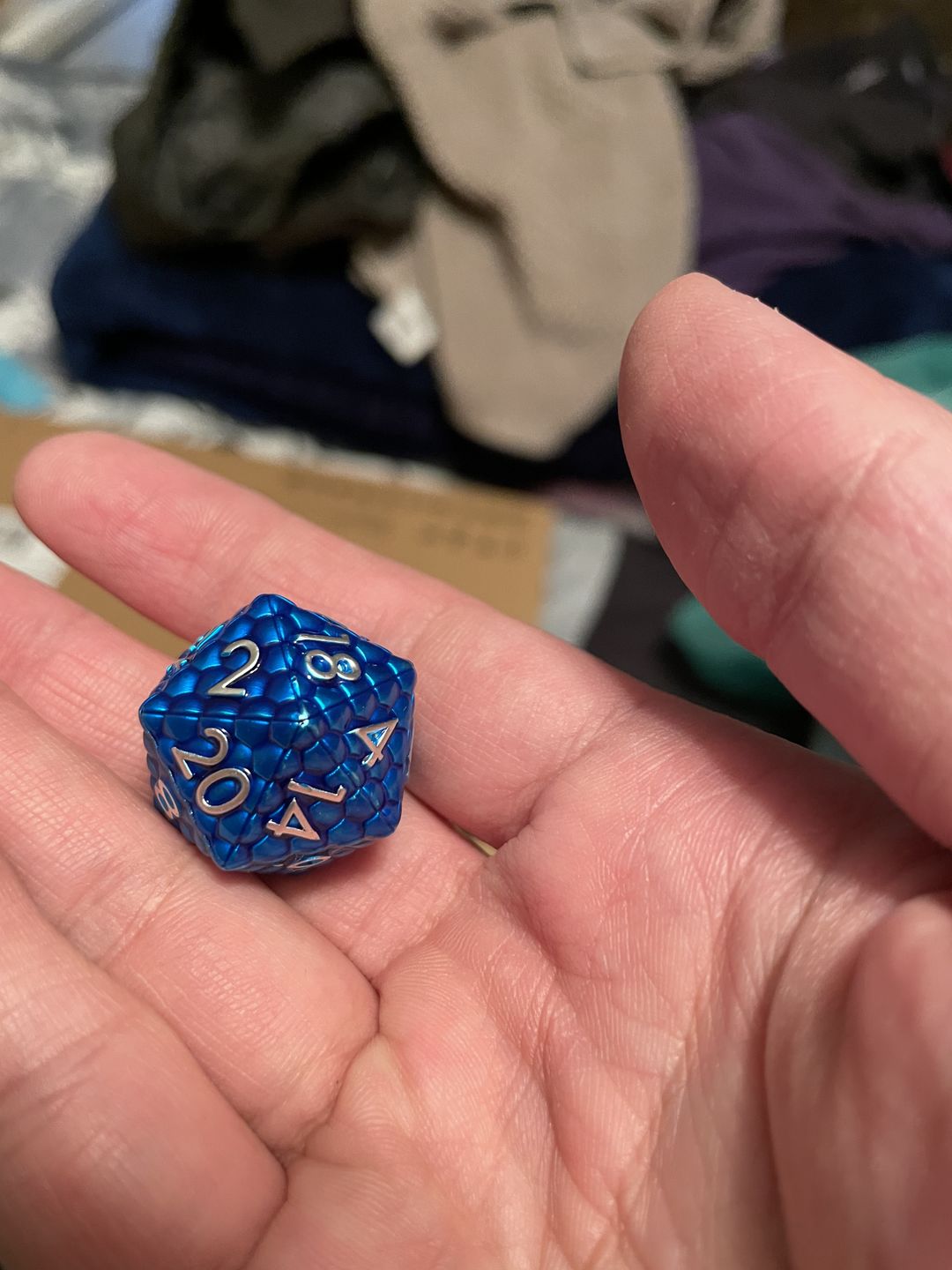 Customer photo review of DRAGON'S EGG BLUE METAL DICE SET