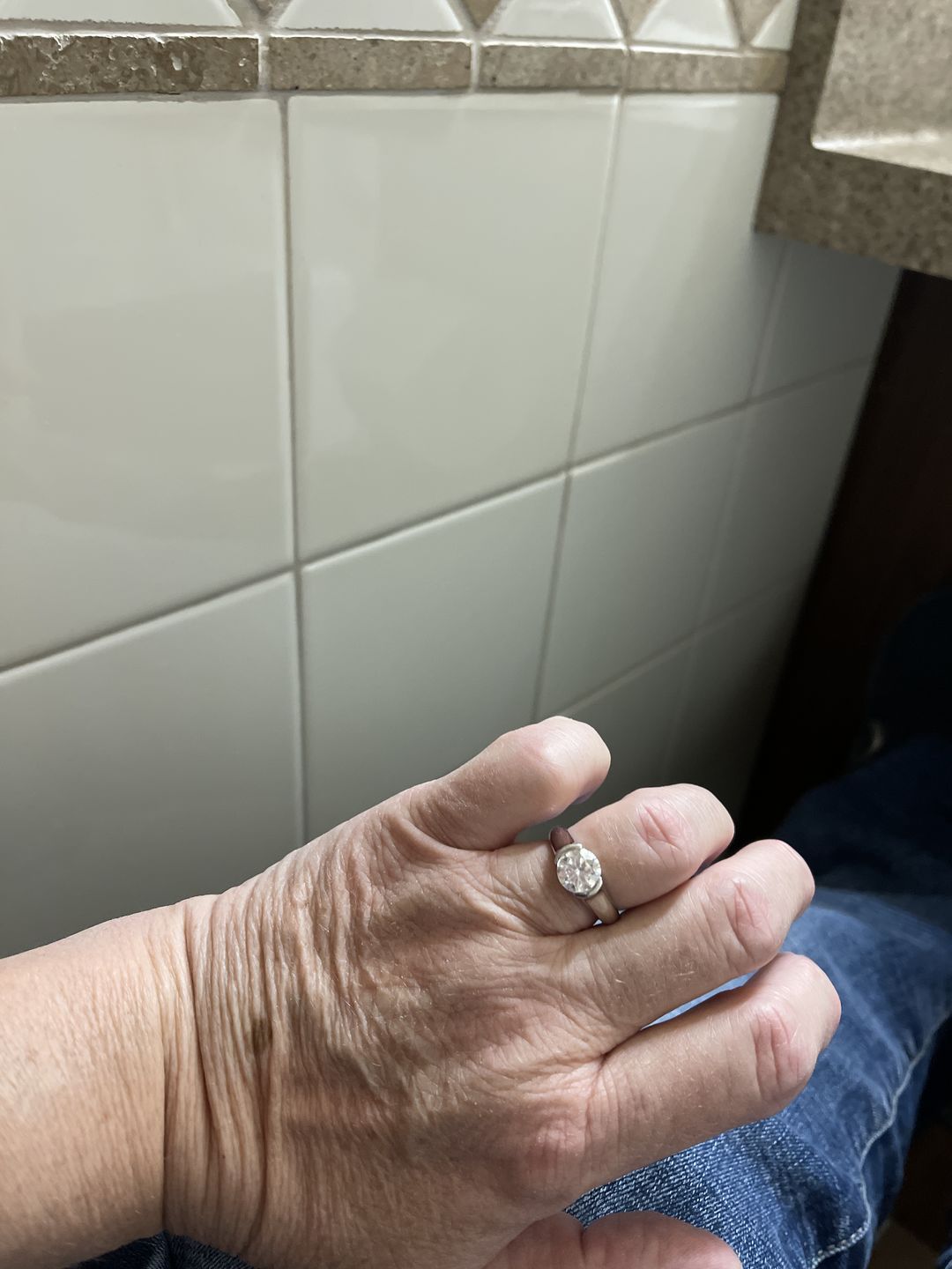 Customer photo review of Solitaire Moissanite Half Bezel Set Sterling Silver Engagement Ring