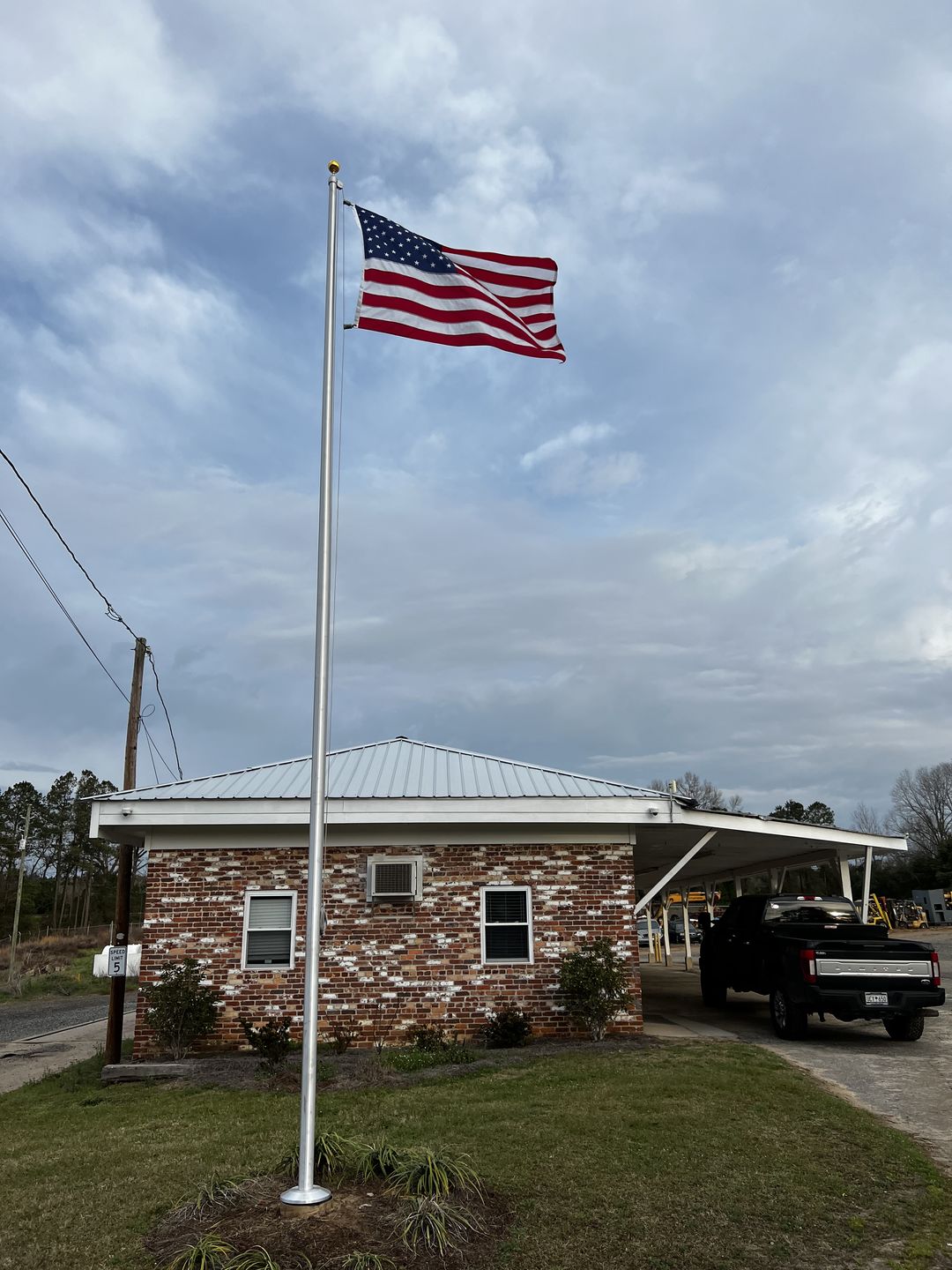 Customer photo review of 25 ft. Commercial Flagpole with External Rope Halyard Rated At 77 mph