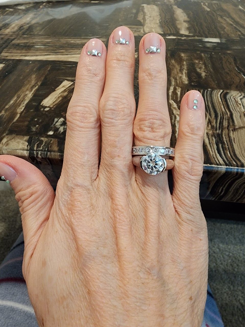 Customer photo review of Solitaire Moissanite Half Bezel Set Sterling Silver Engagement Ring