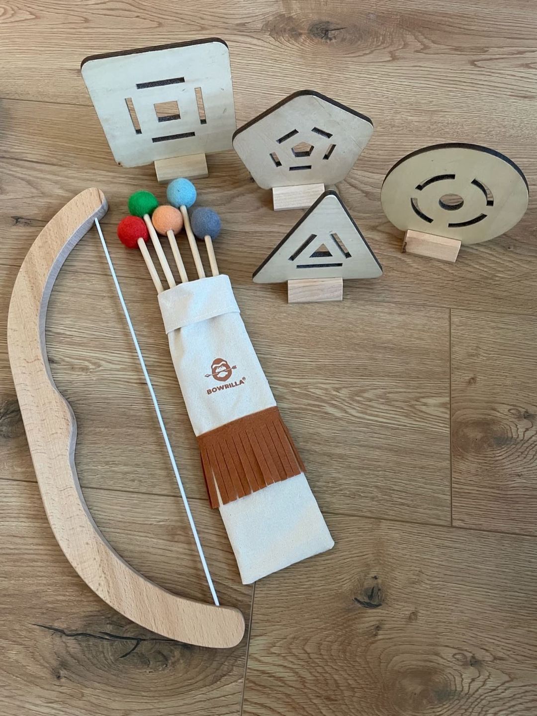 Customer photo review of Pfeil und Bogen Kinder Holzspielzeug mit 5 Pfeilen, Köcher und 3 Zielscheiben