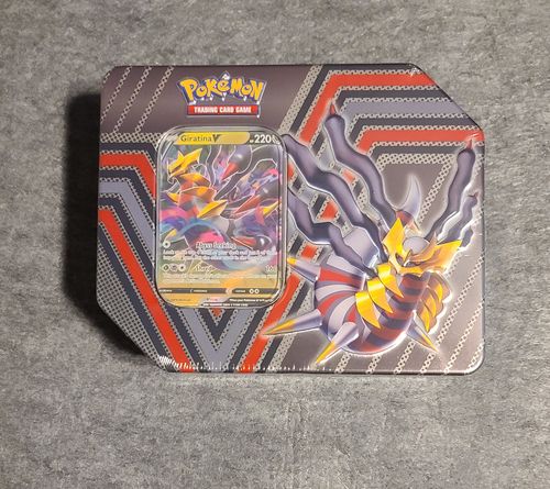 Customer photo review of POKÉMON TCG: DIVERGENT POWERS TIN (Set of 3)