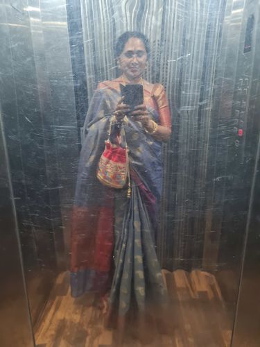 Customer photo review of Rubans Red Coloured Potli Bag With Multicoloured And Golden Embroidery