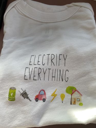 Customer photo review of Electrify Everything Baby Onesie