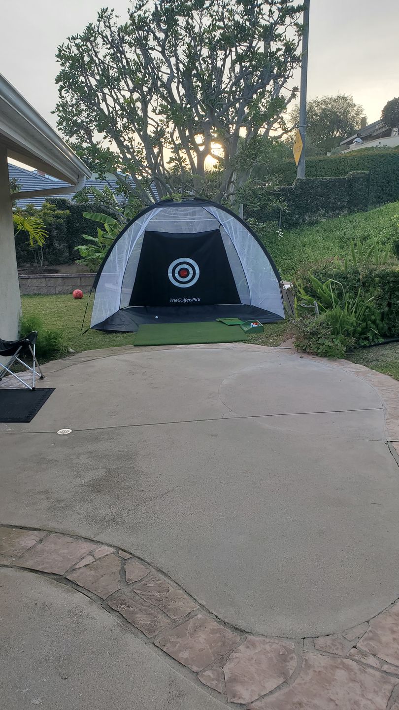Customer photo review of Golf Practice Driving Net for Indoors and Outdoors | Tri-Turf Hitting Mat